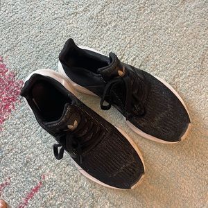 Adidas black and gold size 9 fabric is distressed on top as photographed